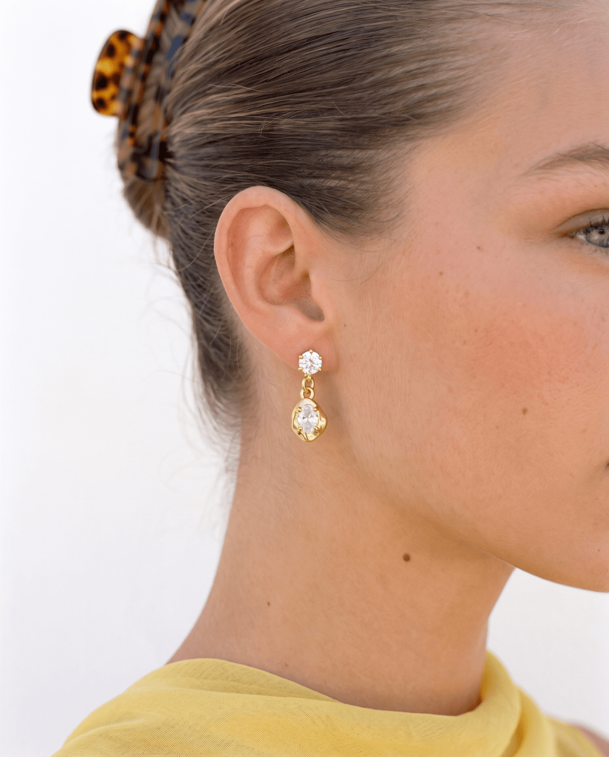 Crystal drop earrings side view, gold tone