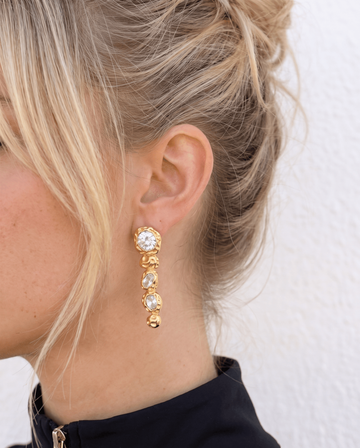 Crystal drop earrings side view, gold tone