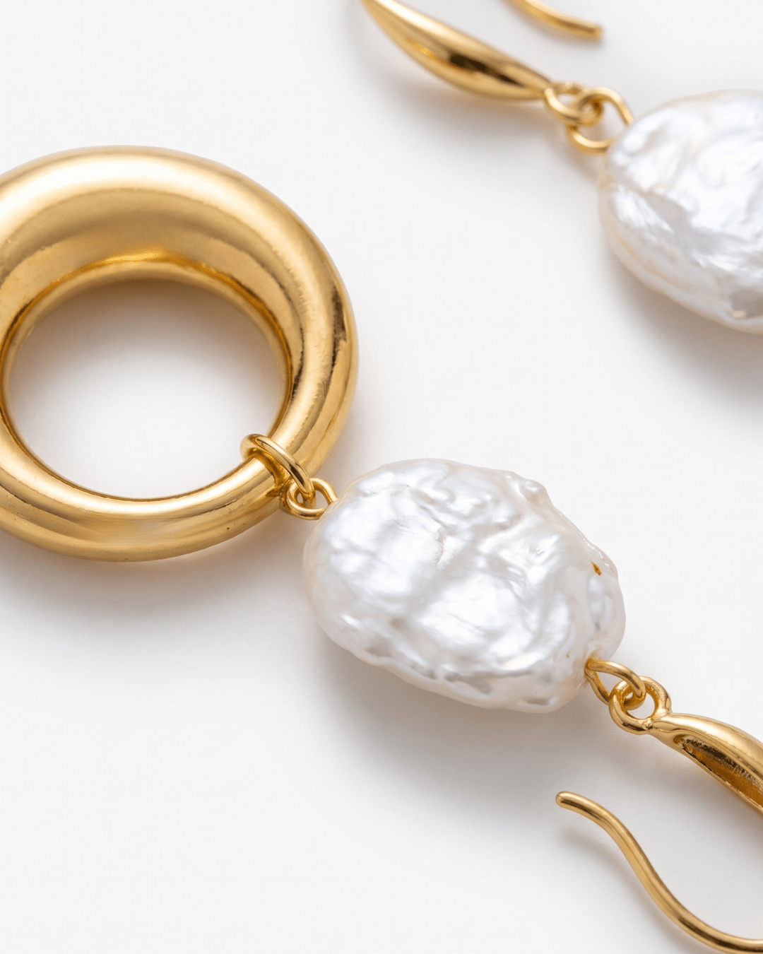 Faux pearl drop earrings with gold-tone ring in gold