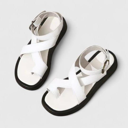 Flat sandals with toe loop and ankle strap in white