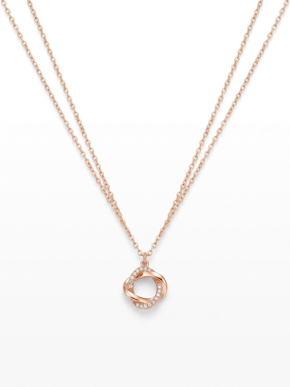 Gold twisted ring pendant necklace on a white background