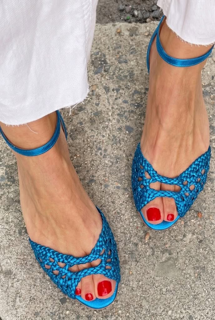 Woven peep-toe flat sandals in blue - worn