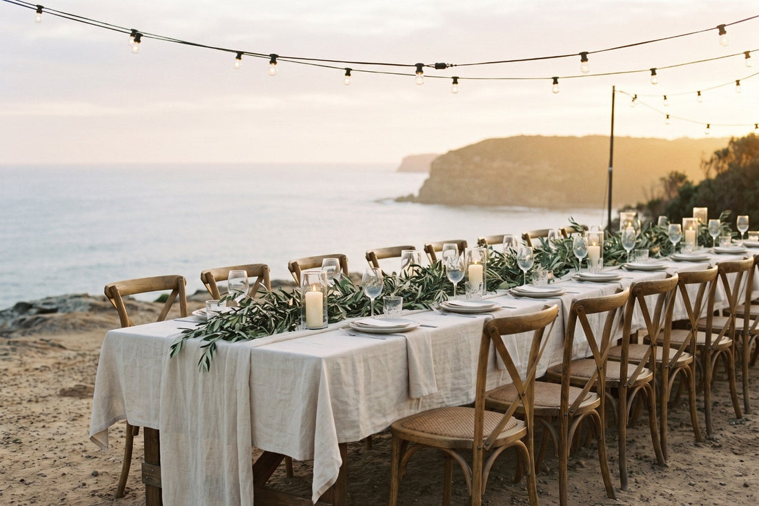 Coastal wedding reception table at golden hour