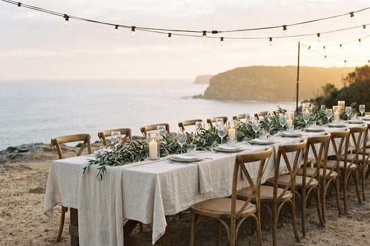 Coastal wedding reception table at golden hour