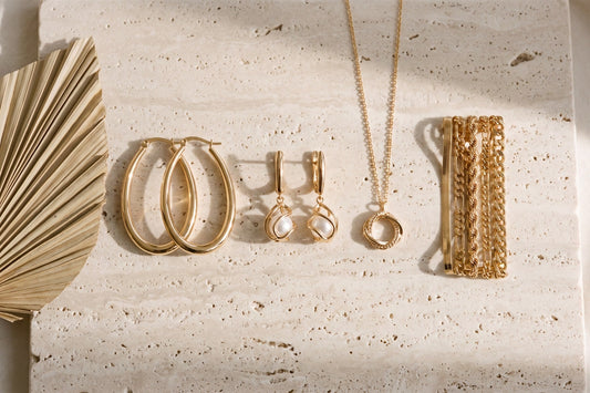 Gold-tone jewellery edit: hoops, pearl drops, pendant and bracelet set