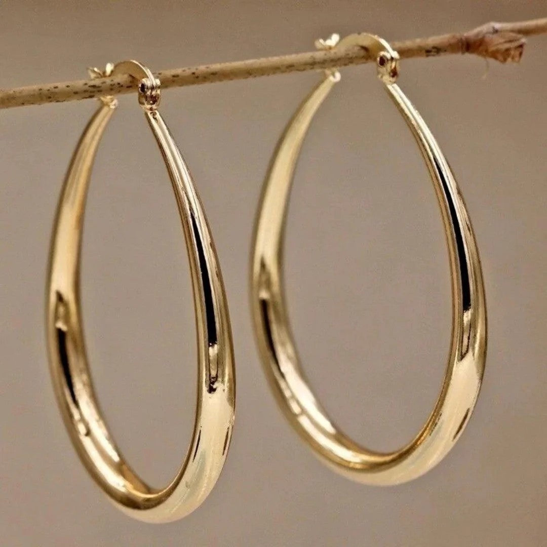Gold oval hoop earrings with polished finish