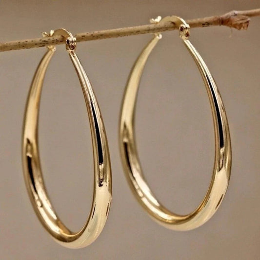 Gold oval hoop earrings with polished finish
