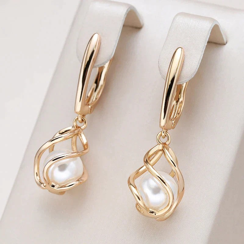 Gold drop earrings with pearl detail