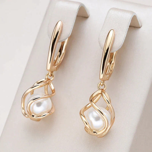 Gold drop earrings with pearl detail