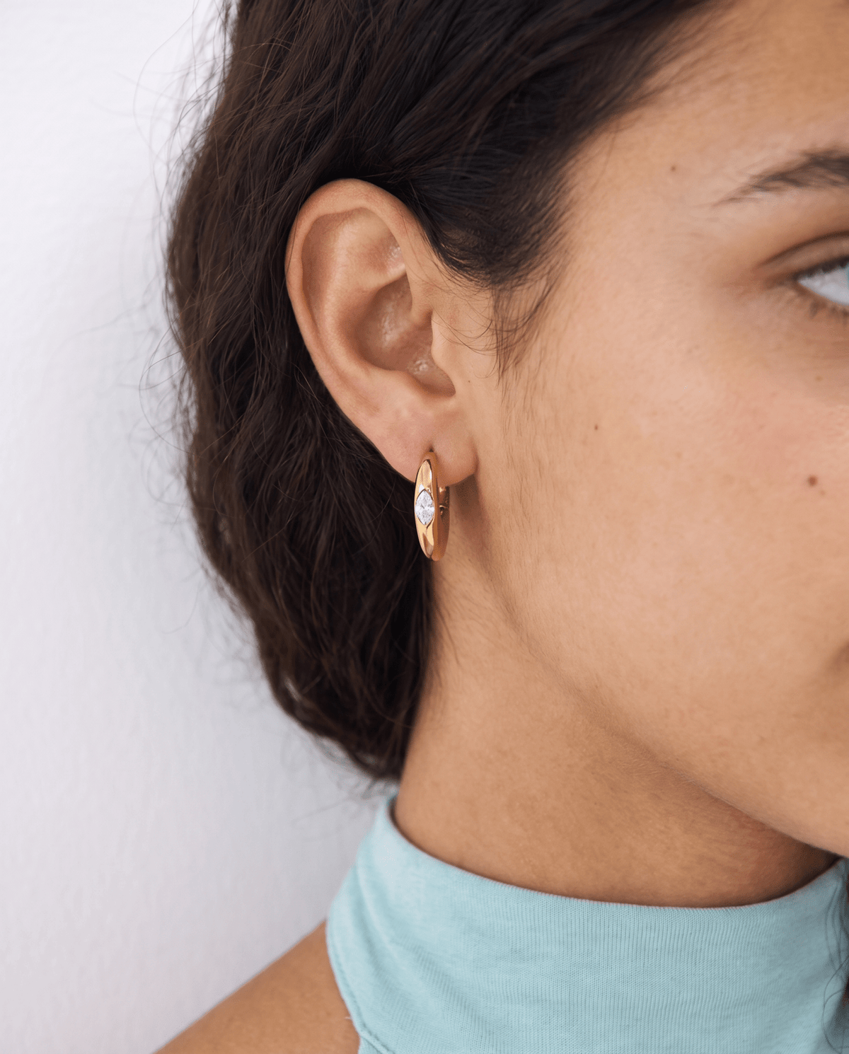 Chunky gold-tone huggie earrings with marquise stone