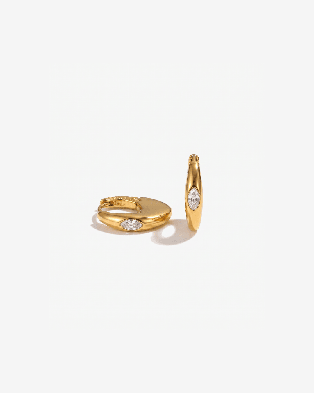 Chunky gold-tone huggie earrings with marquise stone