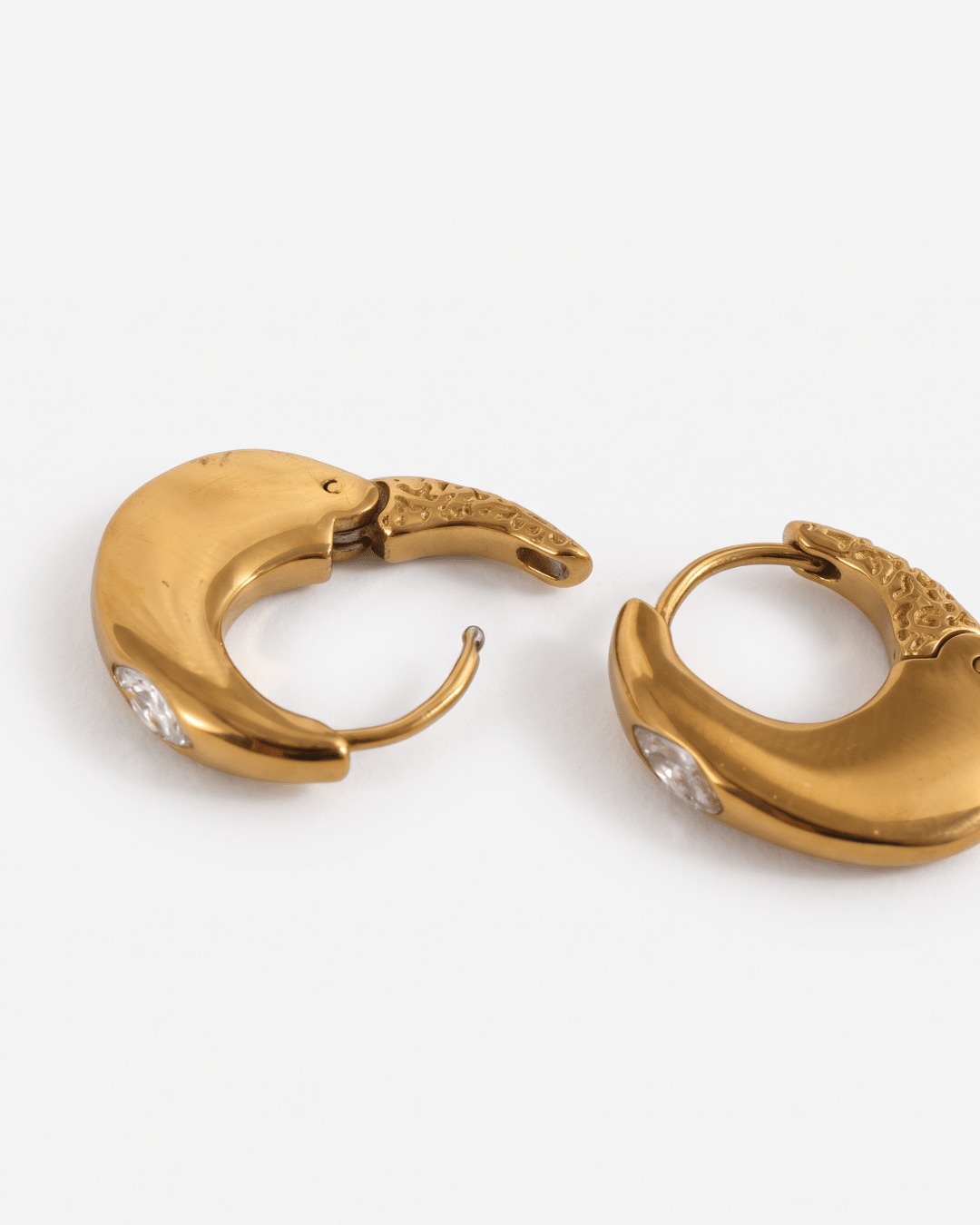 Chunky gold-tone huggie earrings with marquise stone