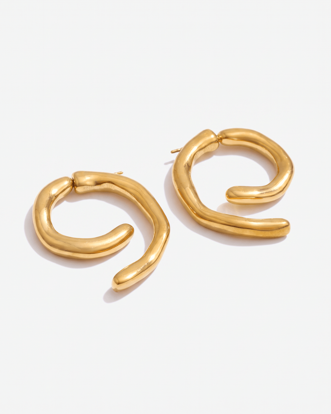 Chunky gold-tone spiral earrings with sculpted curve in Gold