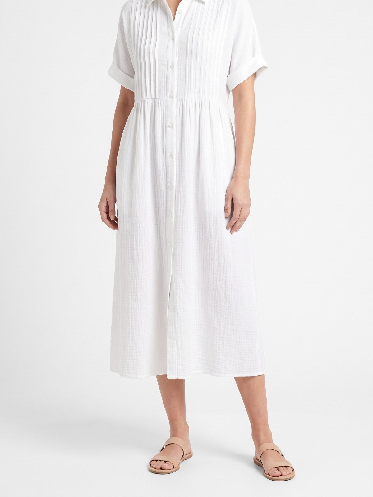White cotton midi shirt dress with button front on a white background