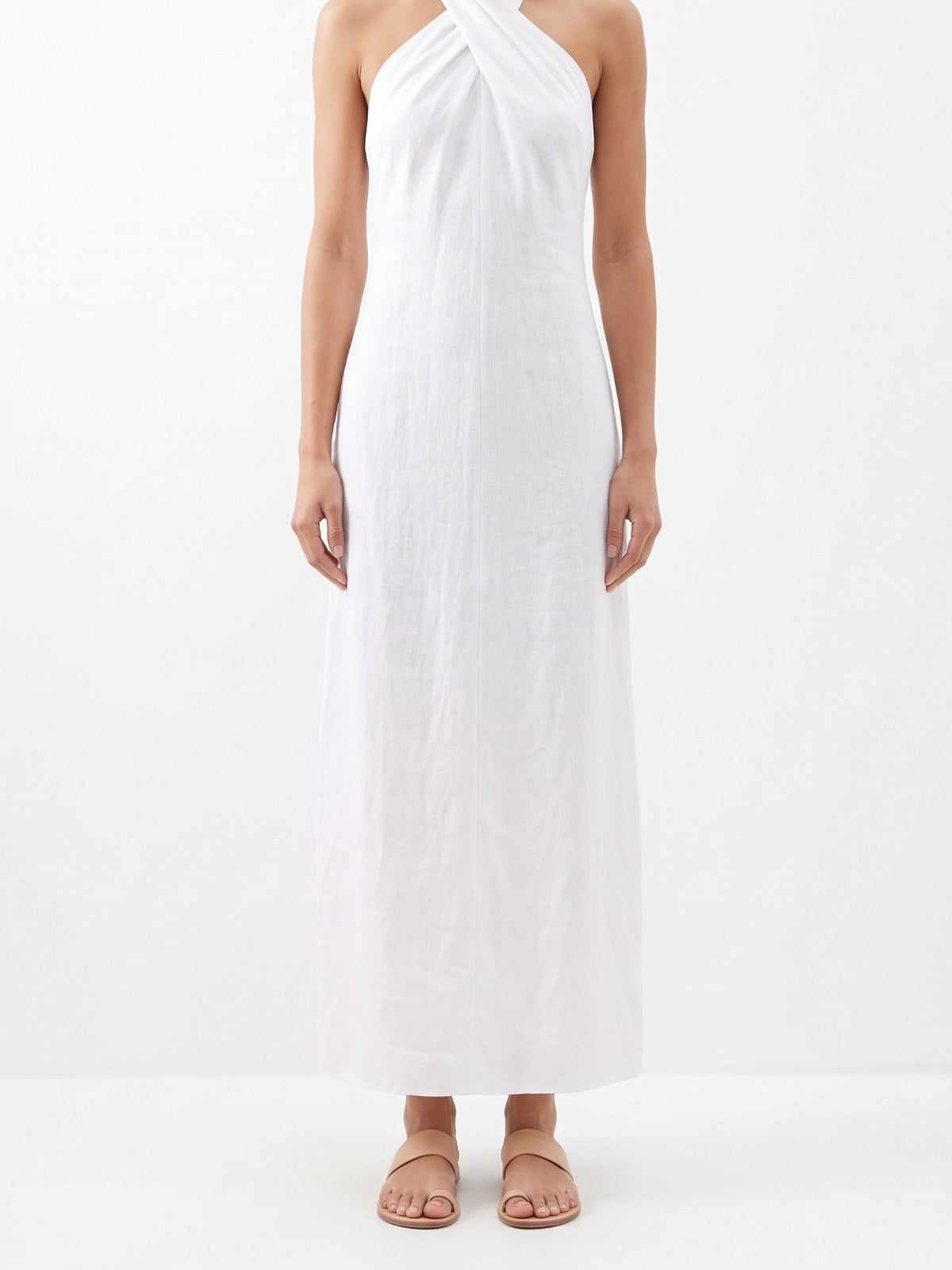 White criss-cross halter neck maxi dress on a white background