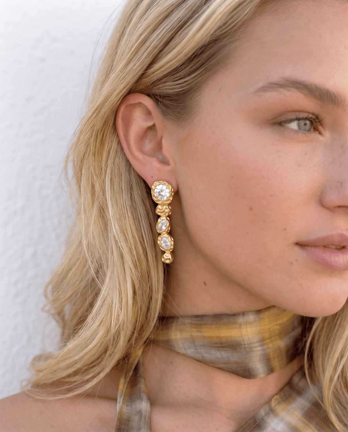 Crystal drop earrings worn, gold tone