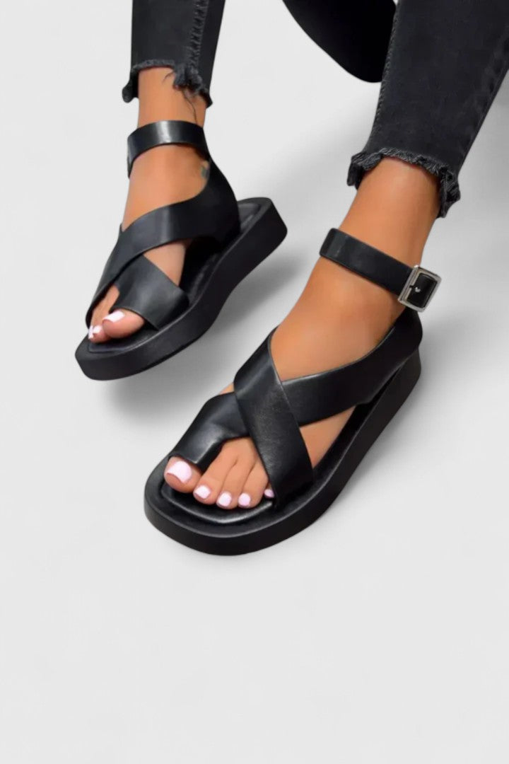 Flat sandals with toe loop and ankle strap in black
