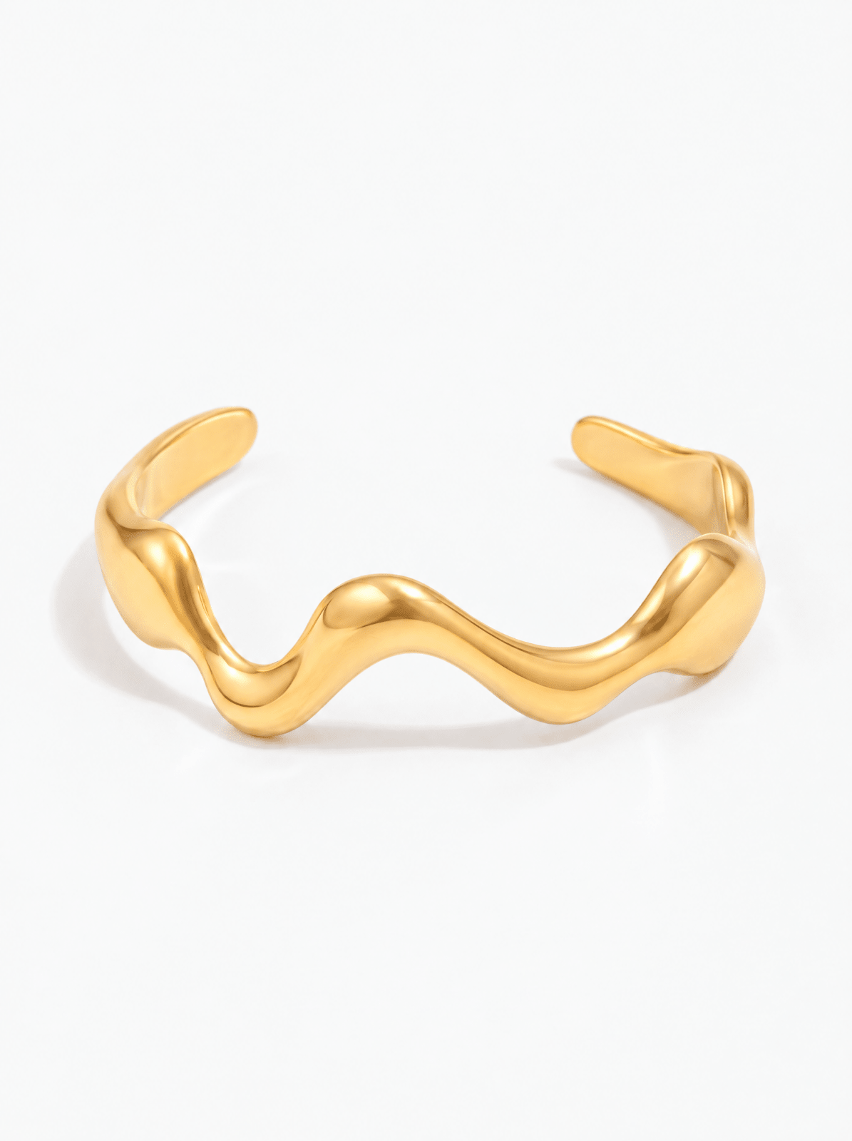 Gold-tone cuff bracelet with wavy design in Gold