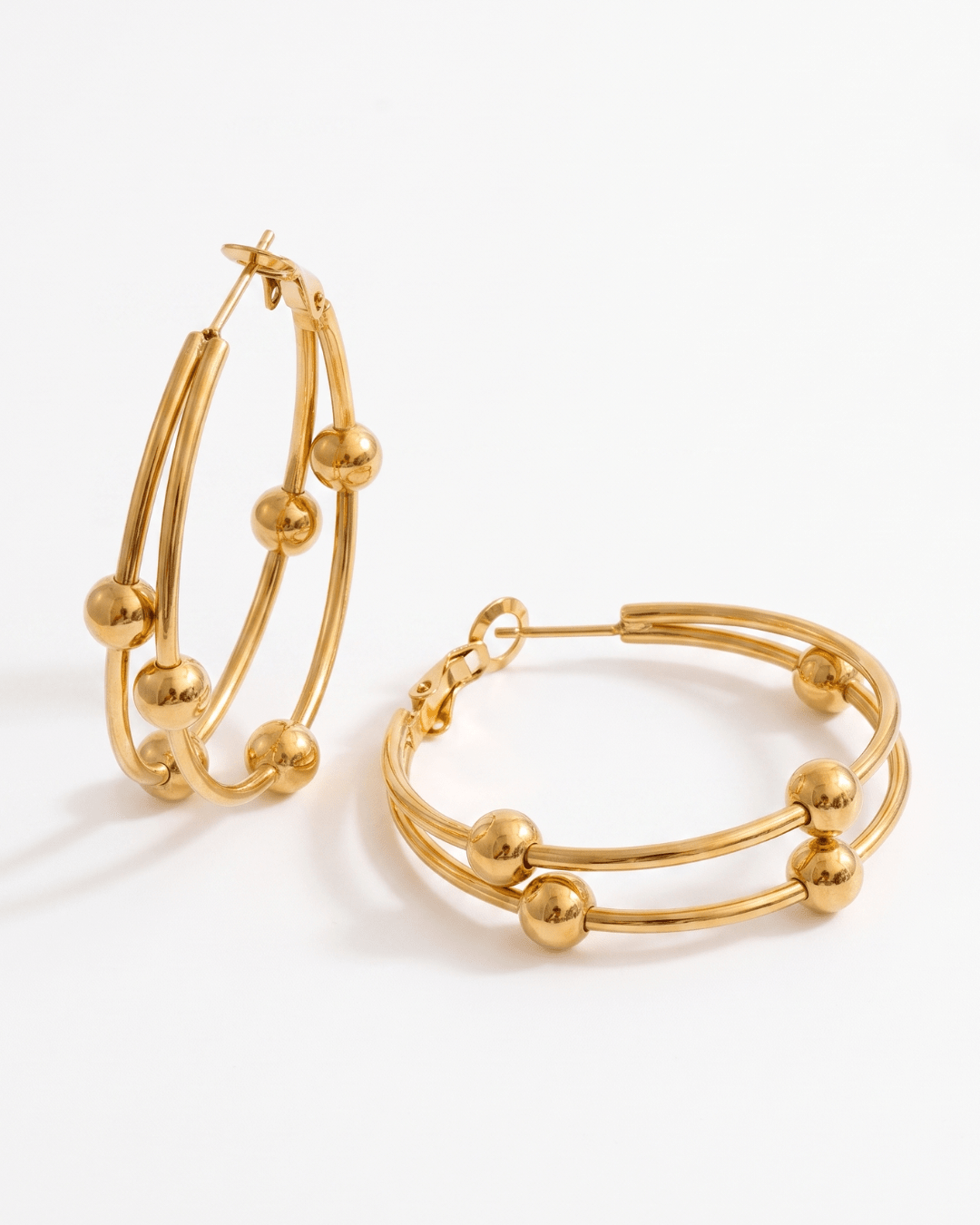 Gold-tone double hoop earrings with sliding beads in Gold
