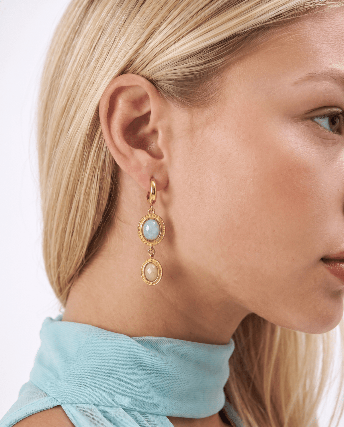 Gold-tone drop earrings with green and cream stones in Gold