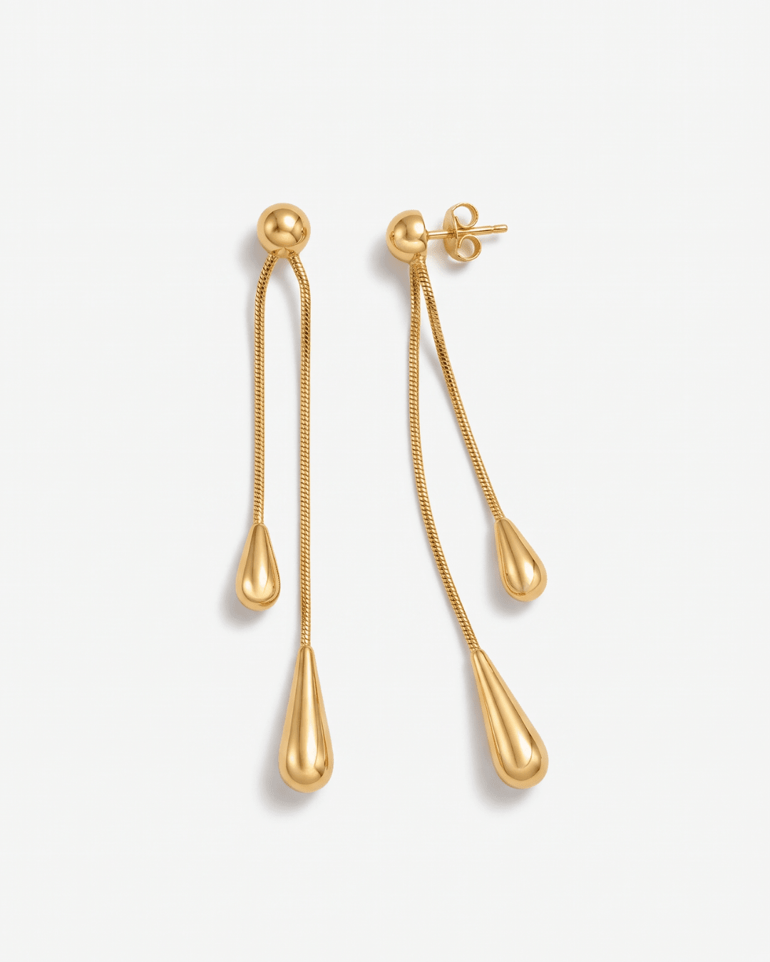 Gold-tone drop earrings with long teardrop design in Gold