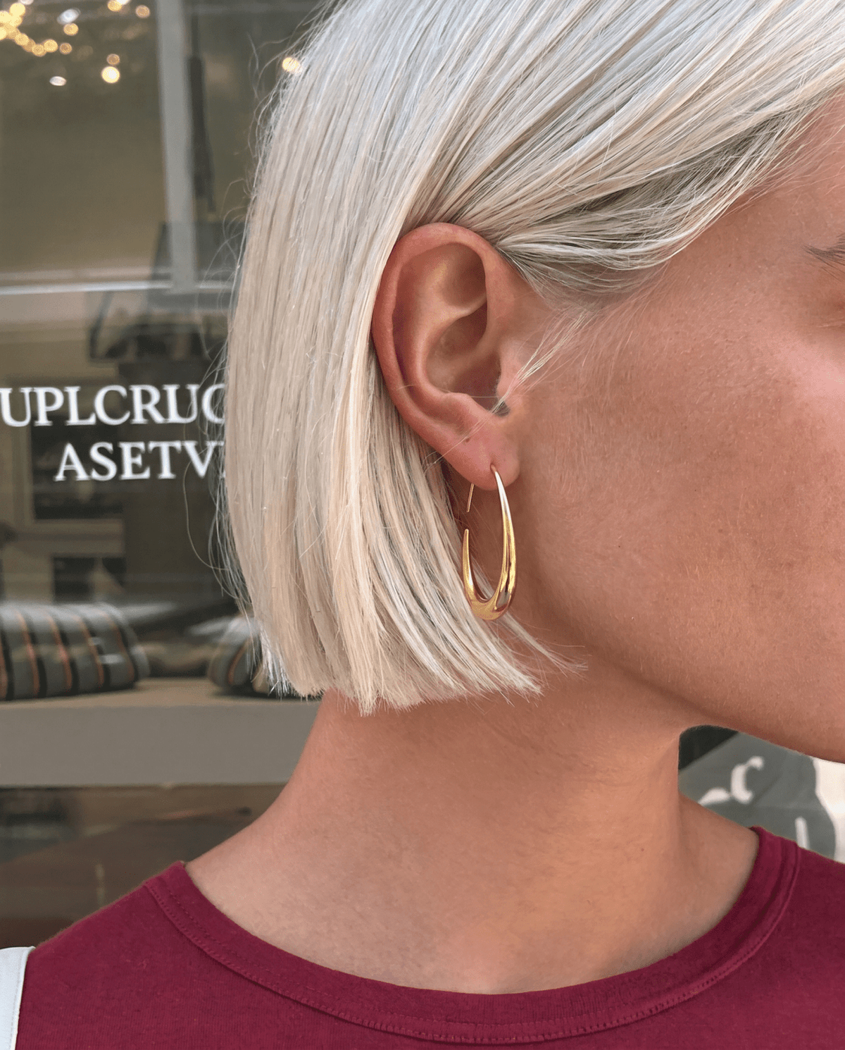 Gold-tone hoop earrings side view