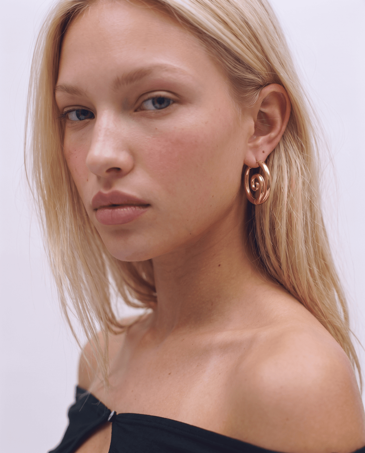 Gold-tone hoop earrings with twisted spiral front in Gold