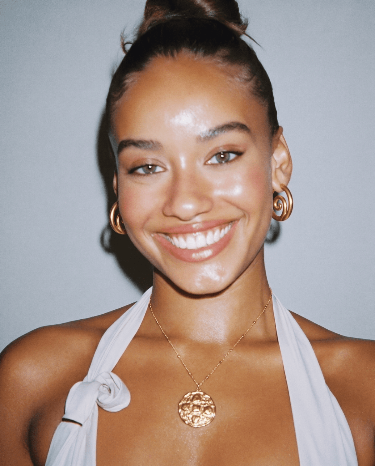 Gold-tone hoop earrings with twisted spiral front in Gold