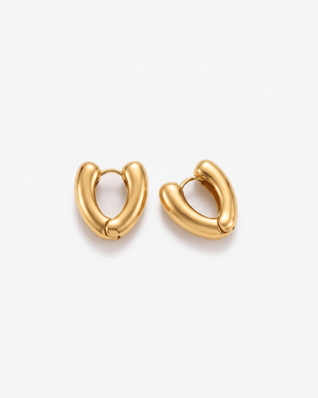 Gold-tone huggie earrings with chunky heart shape