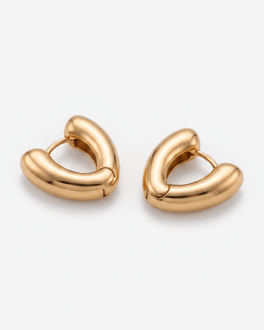Gold-tone huggie earrings with chunky heart shape