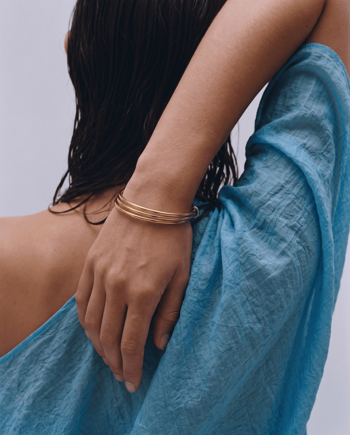 Gold-tone stacked bangle bracelet with three bands in Gold