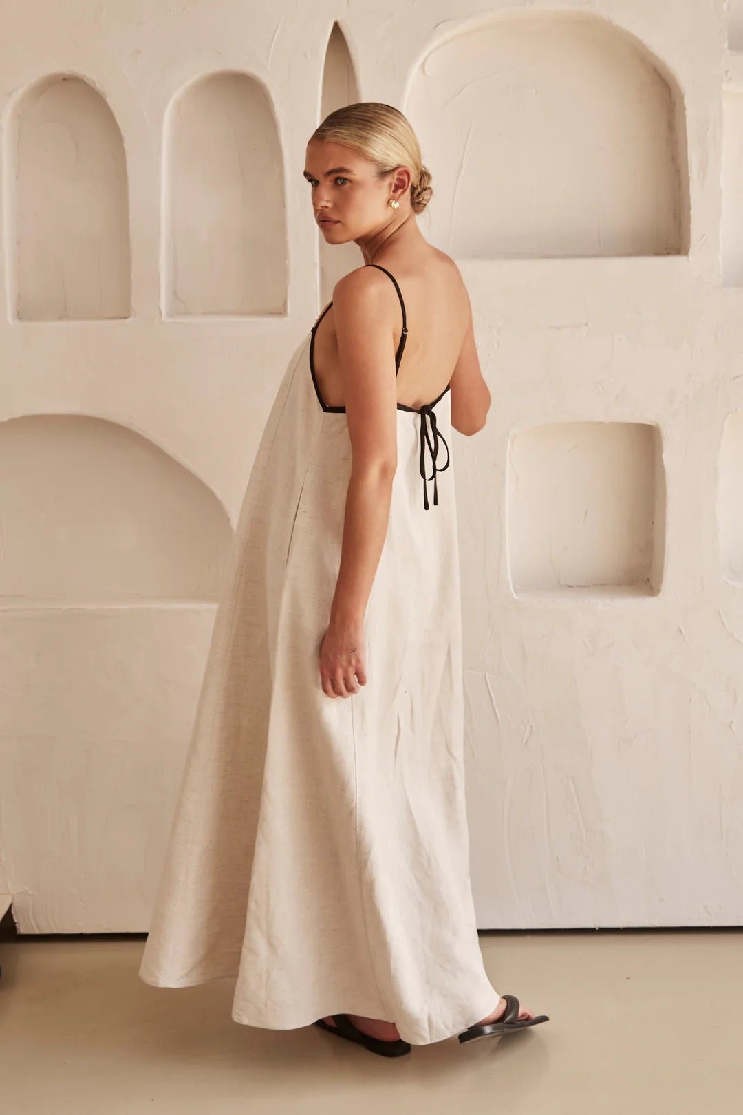 Linen-blend maxi dress in cream - styled