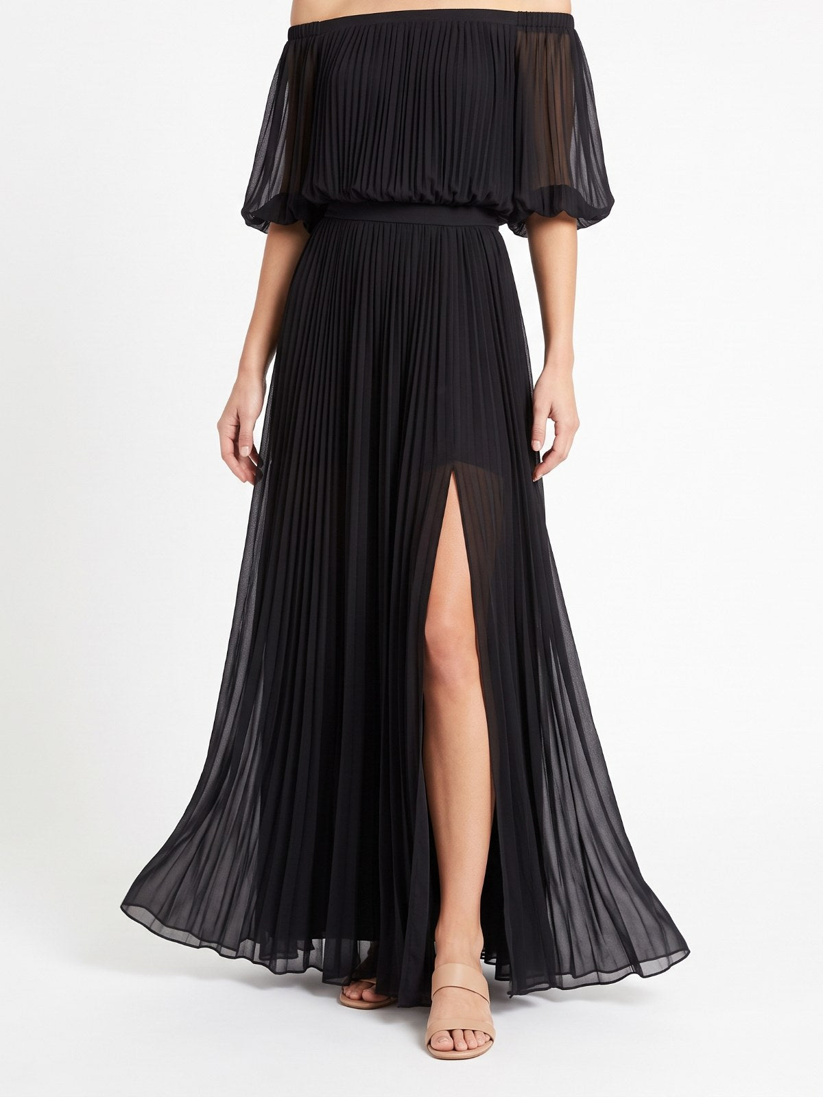 Black off-shoulder pleated chiffon maxi dress on a white background
