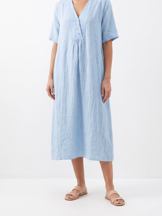 Light blue relaxed linen V-neck midi dress on a white background