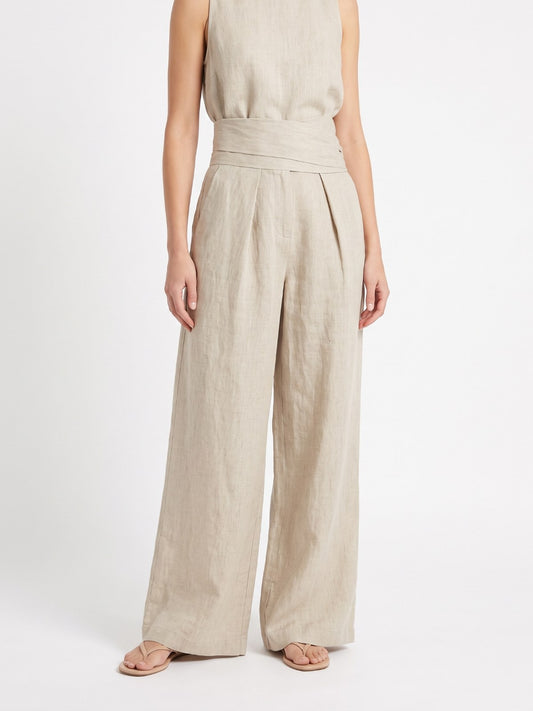Sand sleeveless blouse and wide-leg pants set on a white background