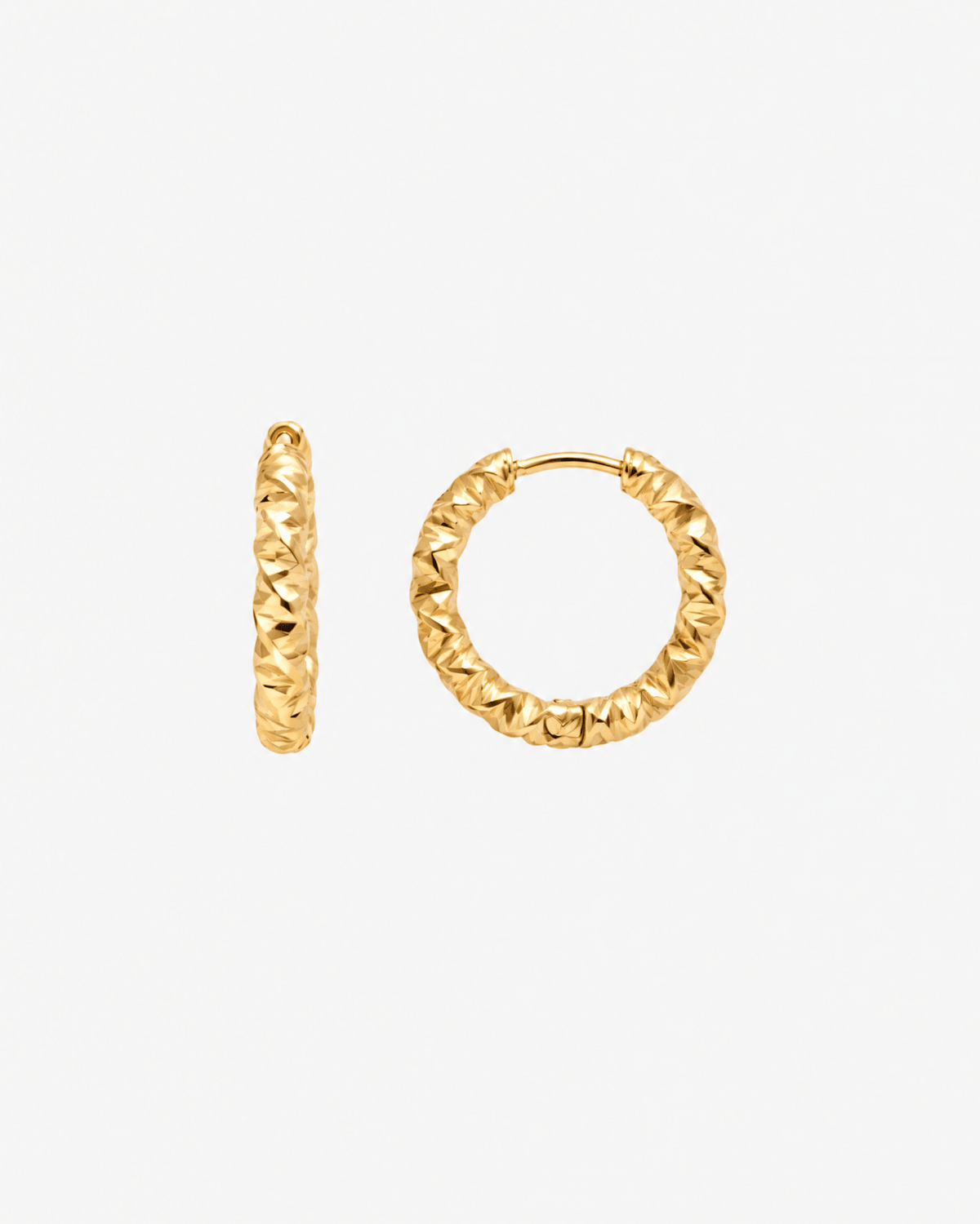 Small gold hoop earrings with faceted finish in gold tone
