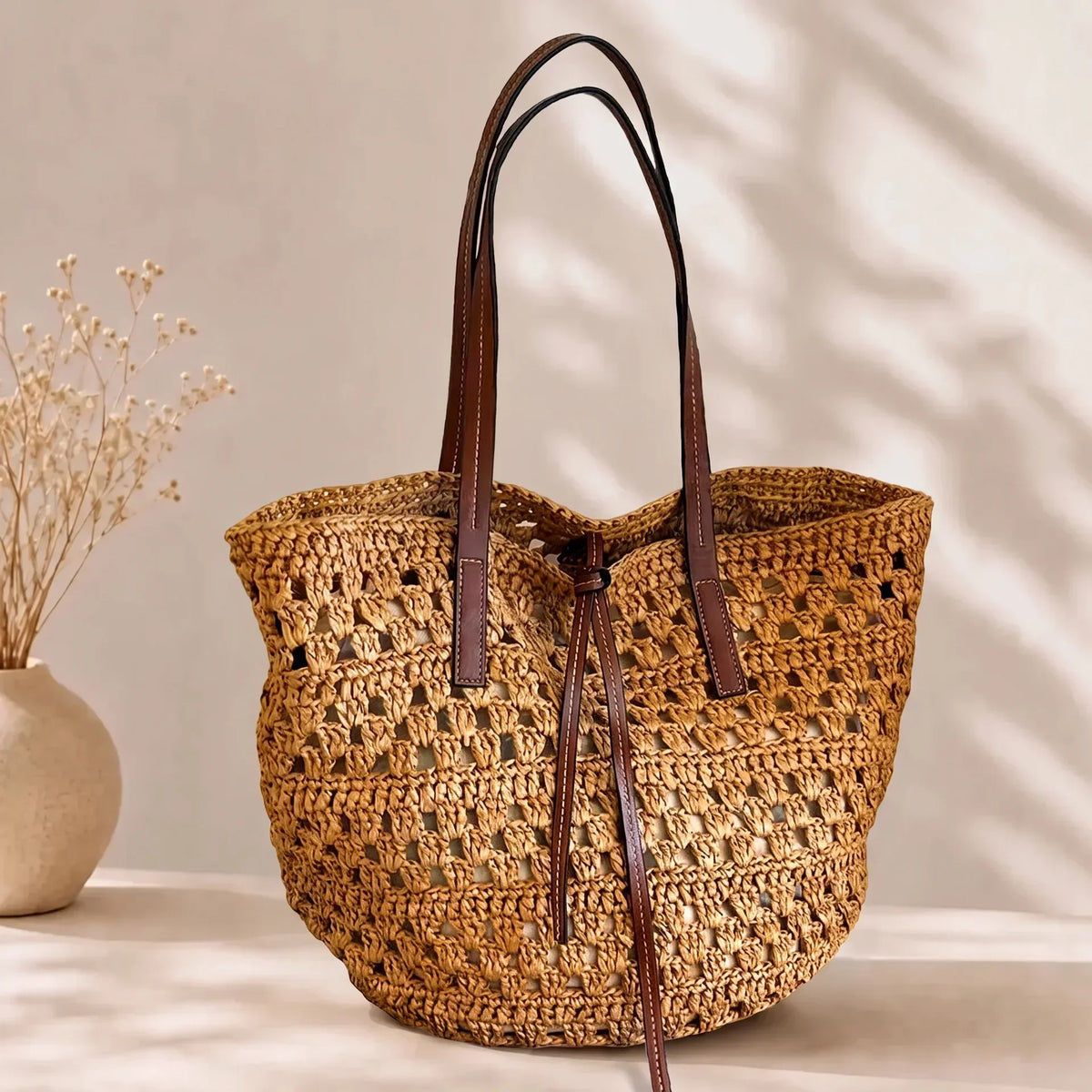 Straw beach bag with open weave in tan
