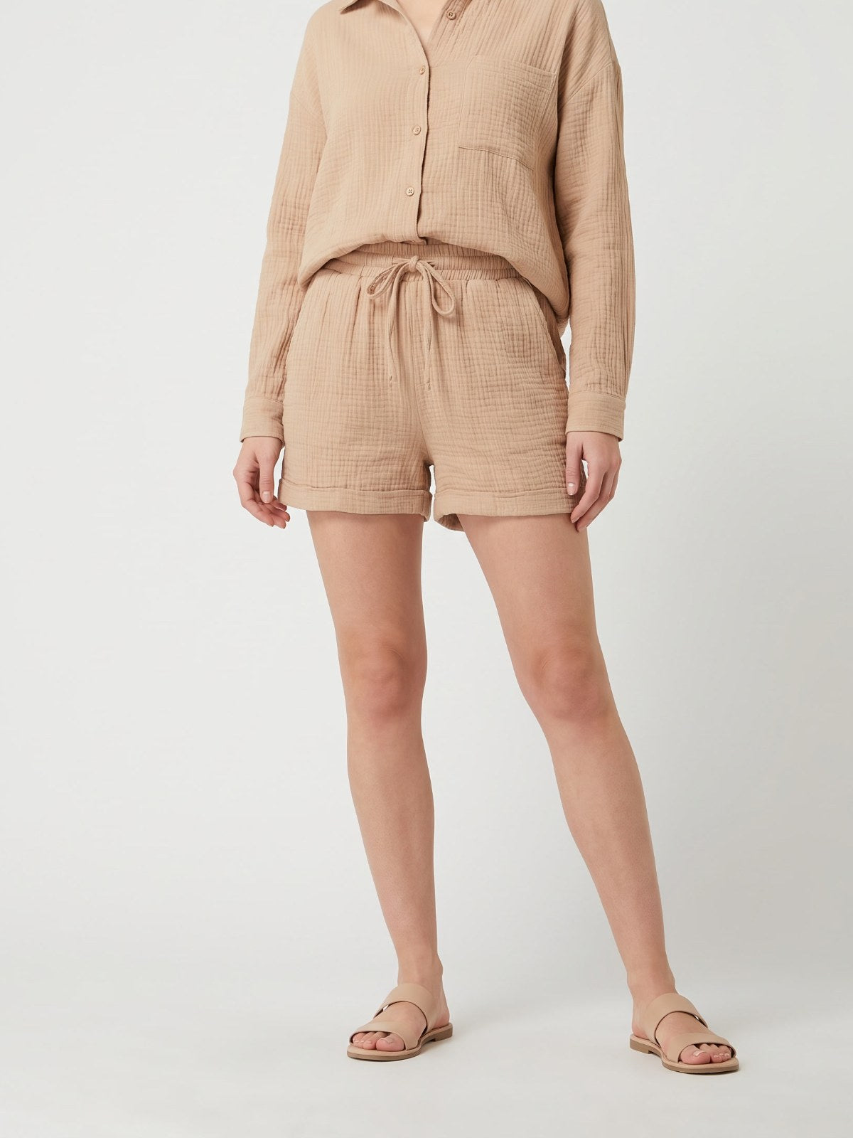 Khaki textured shirt and shorts set on a white background
