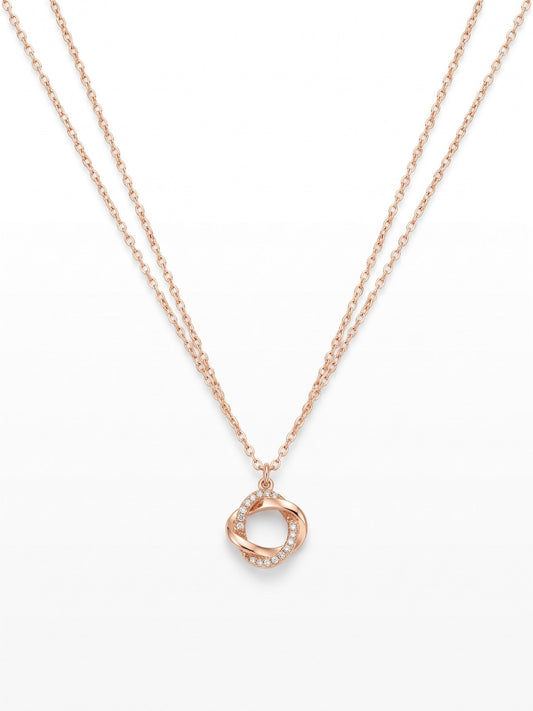 Gold twisted ring pendant necklace on a white background