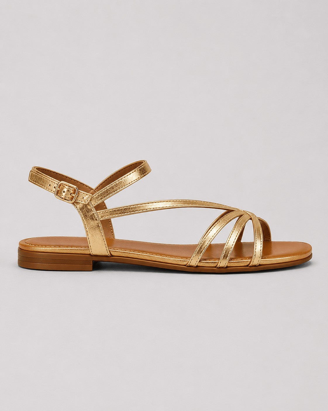 Strappy flat sandals in gold – side view