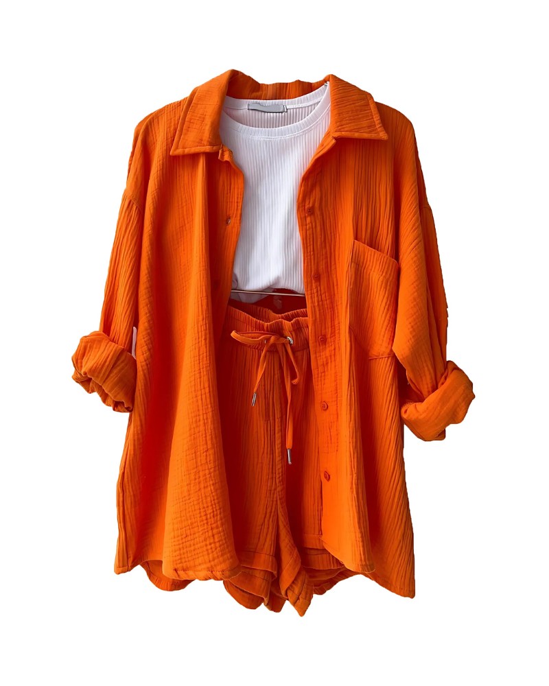 Textured button-up shirt and shorts set in orange – flat lay
