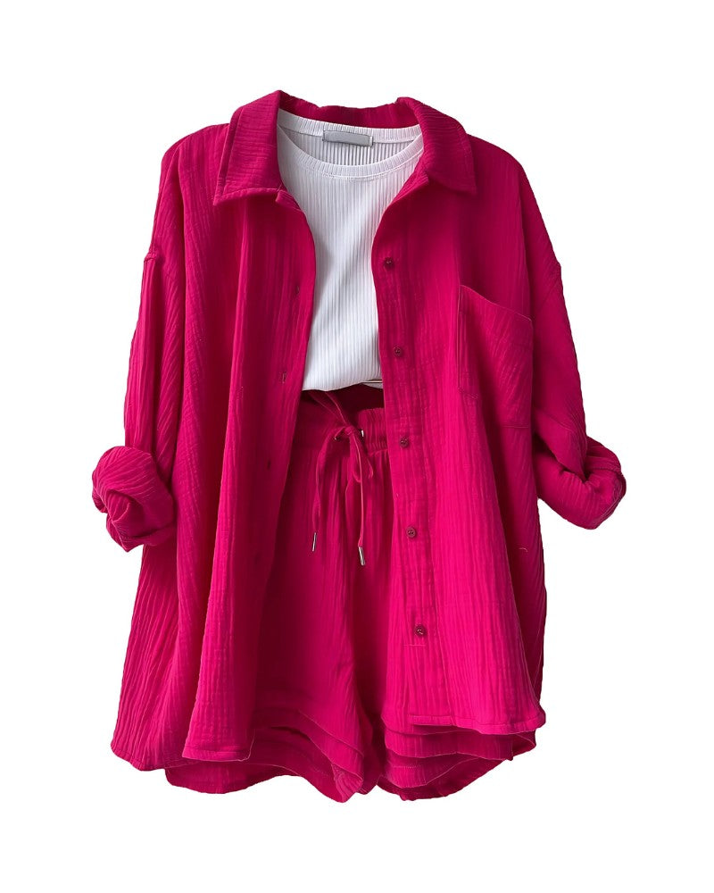 Textured button-up shirt and shorts set in hot pink – flat lay