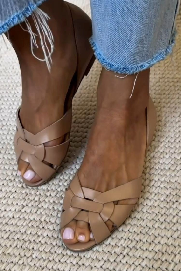 Woven cross-strap flat sandals in beige – top view
