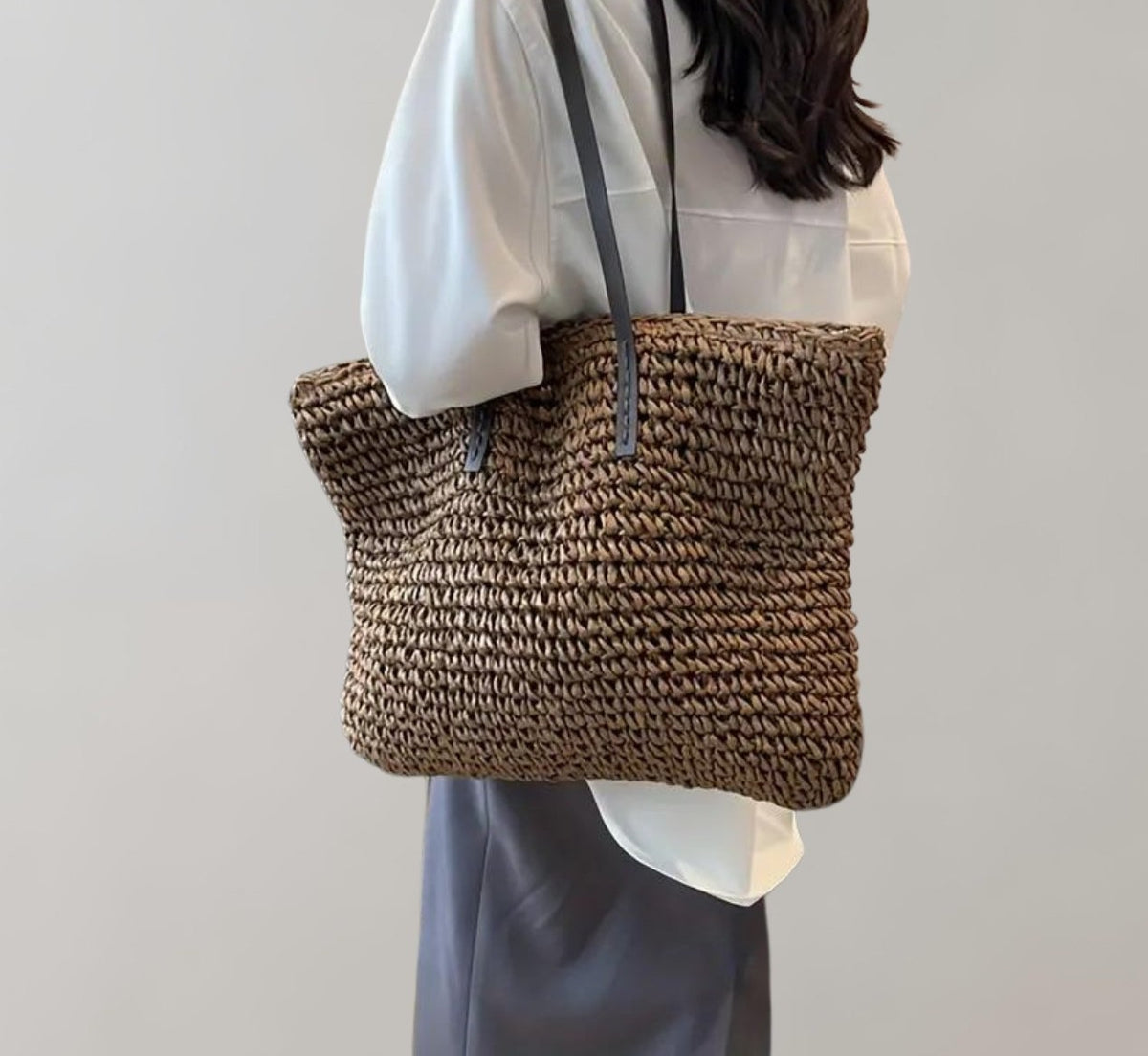 Woven straw tote bag in coffee – side view